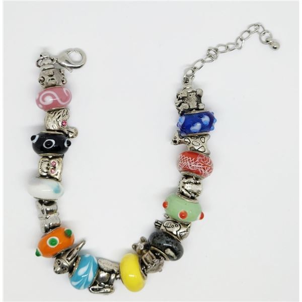 STERLING CHARM BRACELET LOADED WITH CHARMS