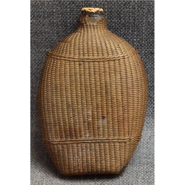 BASKETRY COVERED GLASS BOTTLE