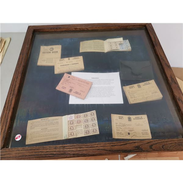 Army Ration books inside display case (25