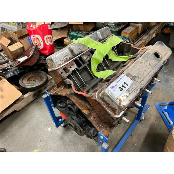 SMALL BLOCK CHEVY ENGINE. NEEDS REBUILDING. 305 CI ON ROLLING STAND. BLOCK NUMBER 14010201. NO