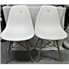 Image 1 : two white plastic/resin molded "bucket" chairs