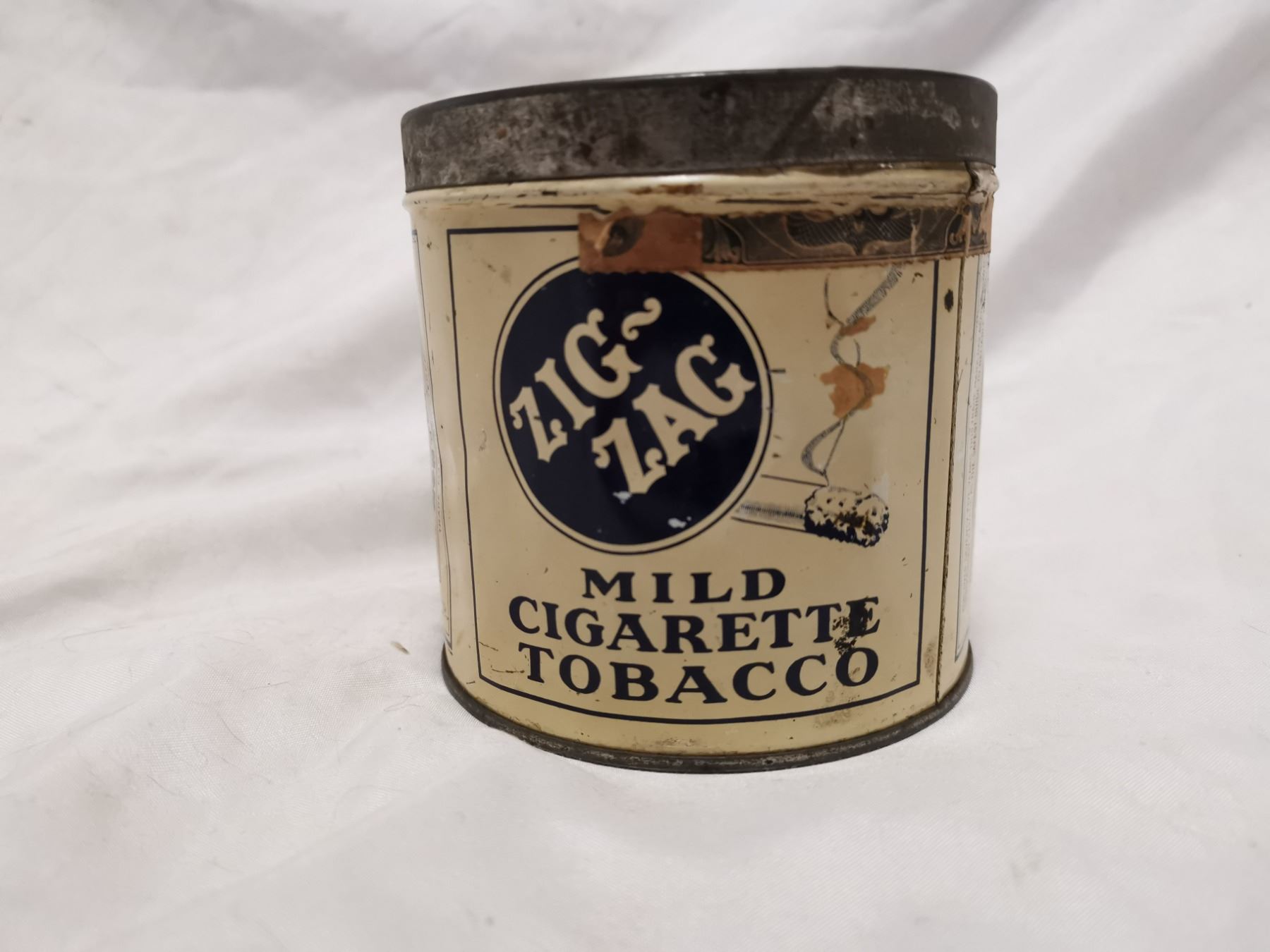 Older Zig Zag tobacco tin can
