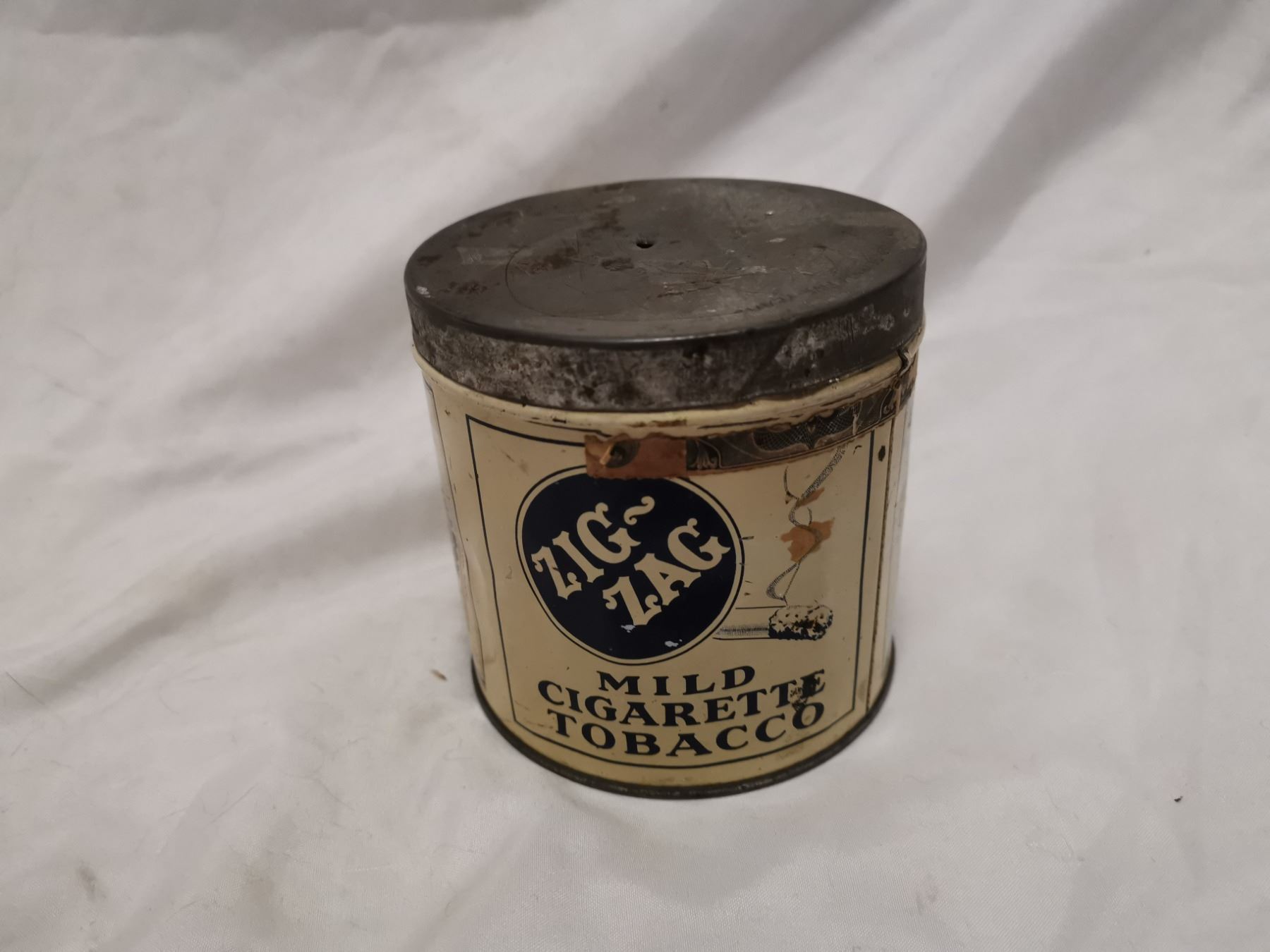 Older Zig Zag tobacco tin can