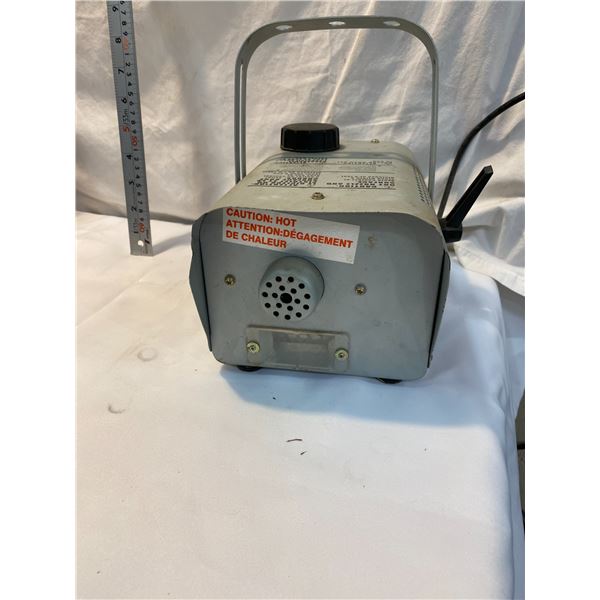 Fog machine, makes noise and lights up too