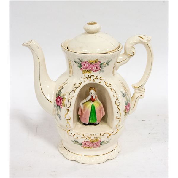 ANTIQUE TEA POT MUSIC BIX WITH LADY INSIDE