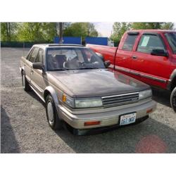 87 NISSAN MAXIMA 4DR EXMT.                                            
