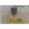 Image 1 : Modern Goodrich Rubber Sign 5.5" x 14.5" , Hilary Sign 4" x 20" - Plastic on Metal & Cornflakes Tin 