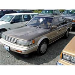 87 NISSAN MAXIMA 4DR EXMT.                                            