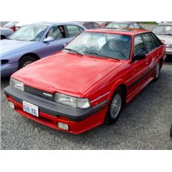 87 MAZDA 626 4DR EXMT.                                                