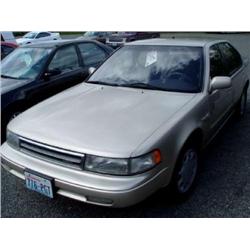 90 NISSAN MAXIMA 4DR EXMT.                                            