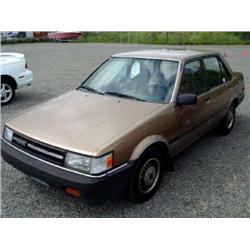 86 TOYOTA COROLLA 5SPD 4DR EXMT.                                      