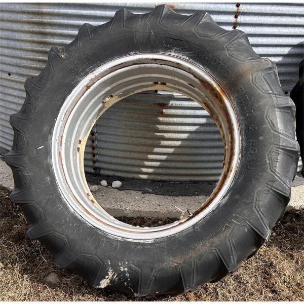 FIRESTONE 18.4-38 TRACTOR TIRE ON RIM - HOLDING AIR 