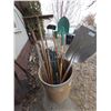 Image 1 : Barrel with Assorted Gardening Tools