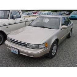 90 NISSAN MAXIMA 4DR EXMT.                                            