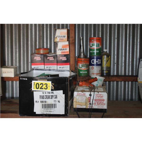 Oil filters, oils cans, battery charger & misc. pails