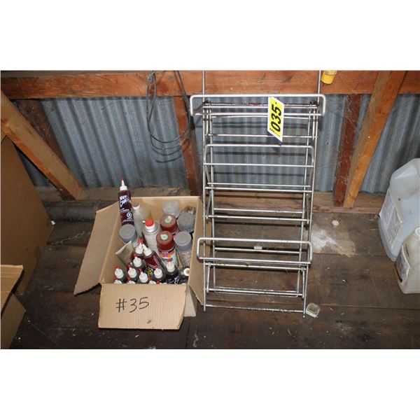 Approx. 14- bottles of nutcracker lube & aerosol cans & stand