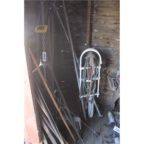 Misc. in east corner of shed (crowbar & cords)