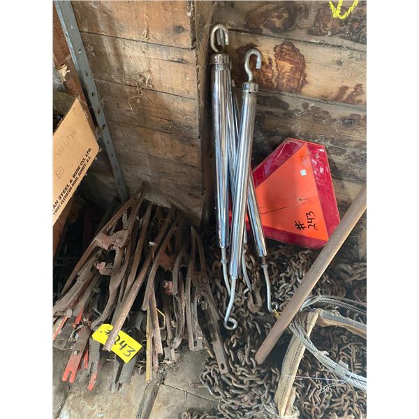 Tire chains, misc. chains, crank gas pump and crop lifters & 4- turnbuckles, slow moving sign.