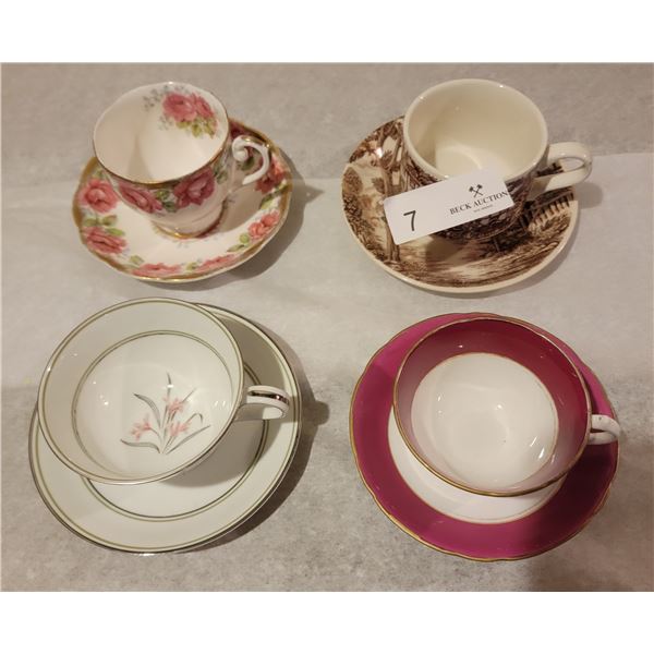 An Assortment Of Four Gorgeous Tea Cups With Matching Saucers