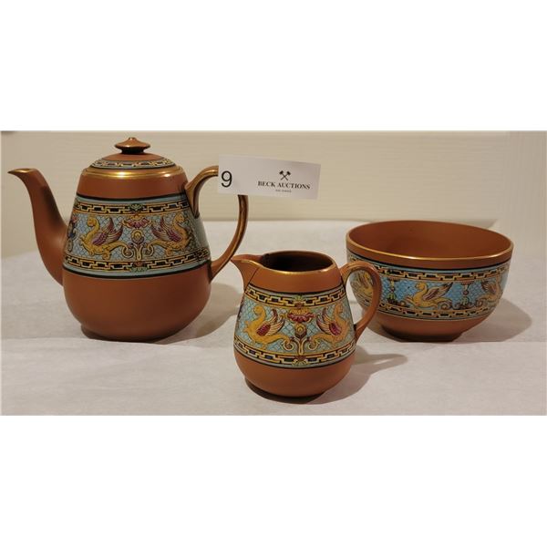 A Watcombe Tea Pot/Creamer And Bowl.