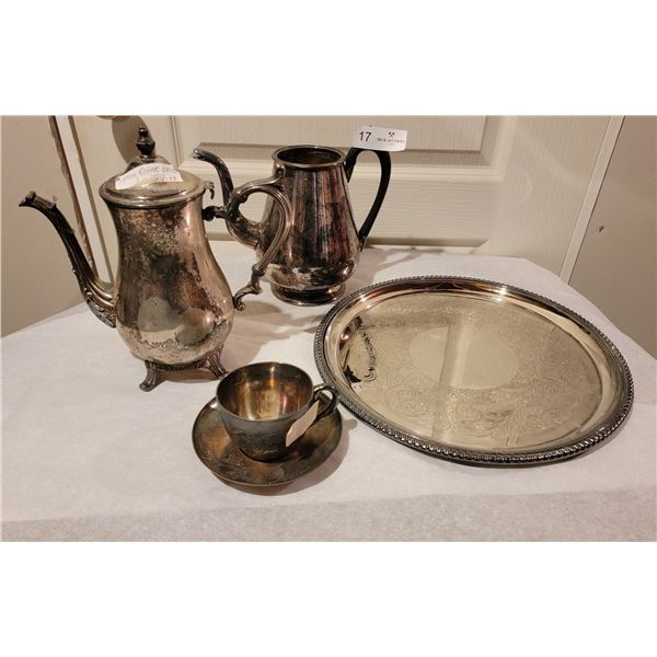 A Pair Of Metal Tea Pots, A Silver Plated Serving Tray, And Silver Plated Tea Cup And Saucer