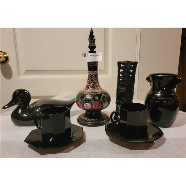 An Assortment Of Dark Black Glassware and Ornaments