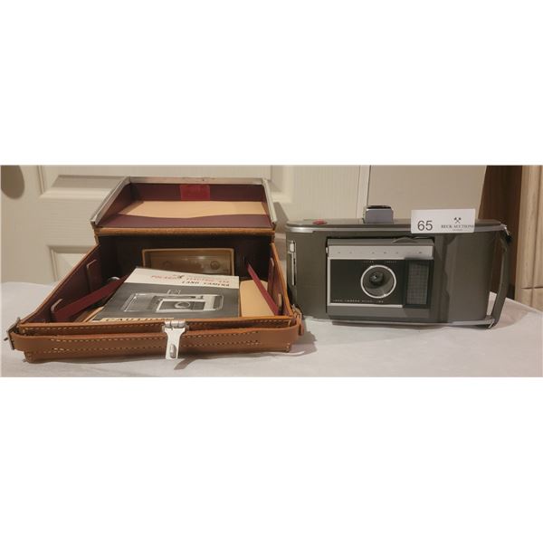 A Polaroid Land Camera: Model J66, Complete With Case.