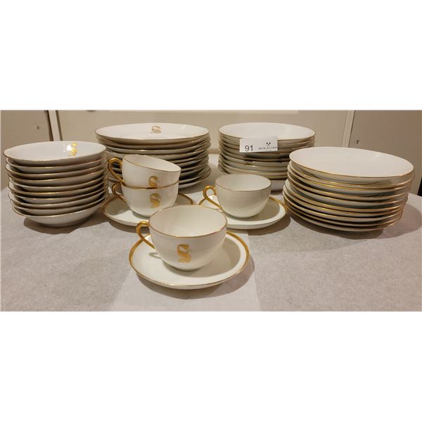 A Beautiful Collection of Matching Porcelain Dishware Centered Around The Letter "S".