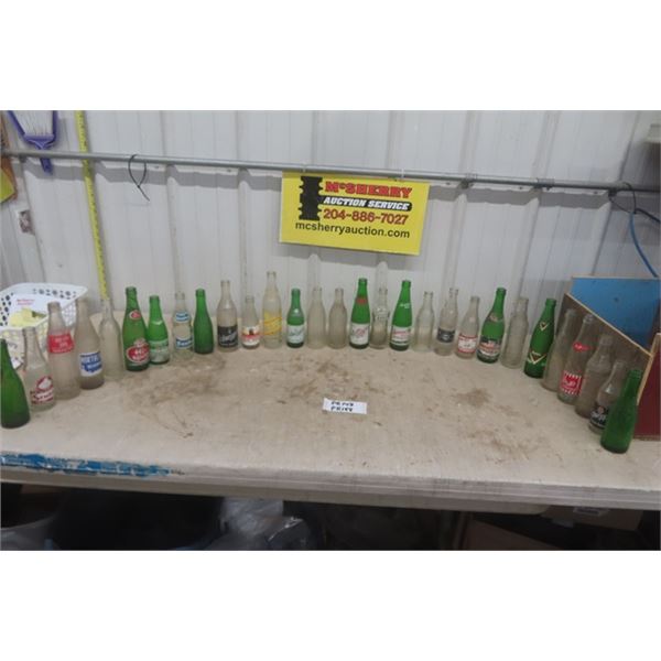 29 Assorted Pop Bottles; Stubby, Crush, Fanta, Dad's, plus more