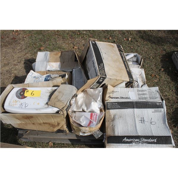 Pallet of new toilets and plumbing hardware