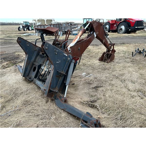 Backhoe attachment, Melroe# 811, (Burnt) SN. 630000964, Fits skid steer (PH Terry (780) 907-4064)