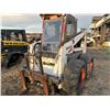 Image 2 : 975 Bobcat, No visible hrs, (no door) running, SN. 4963-M-12805, sells with forks and 84" bucket (PH