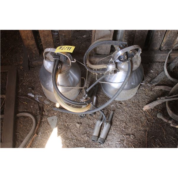 2 Milking pots ( At Adolph's Adolph Pasay 780-942-2153)