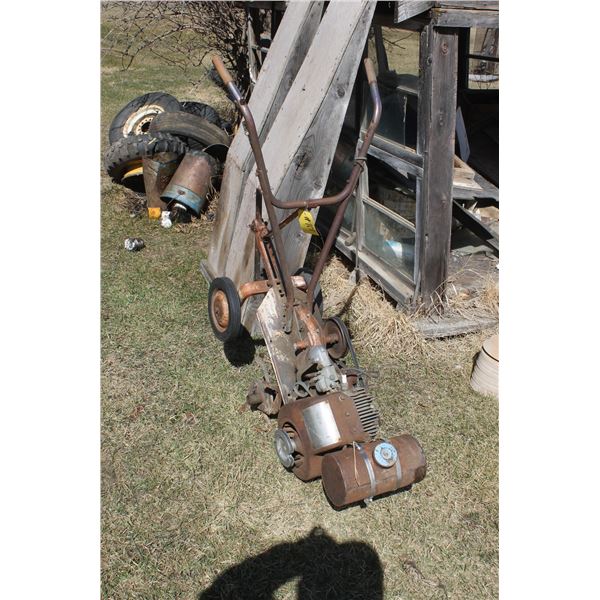 old rototiller ( At Adolph's Adolph Pasay 780-942-2153)