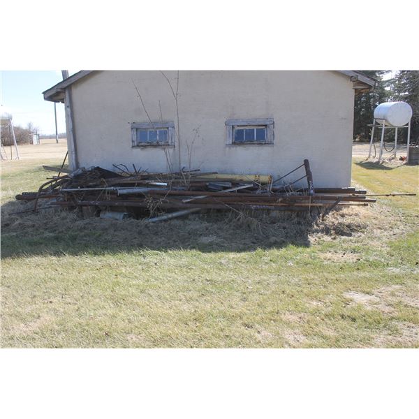 Scrap steel  north of garage and west of garage ( At Adolph's Adolph Pasay 780-942-2153)