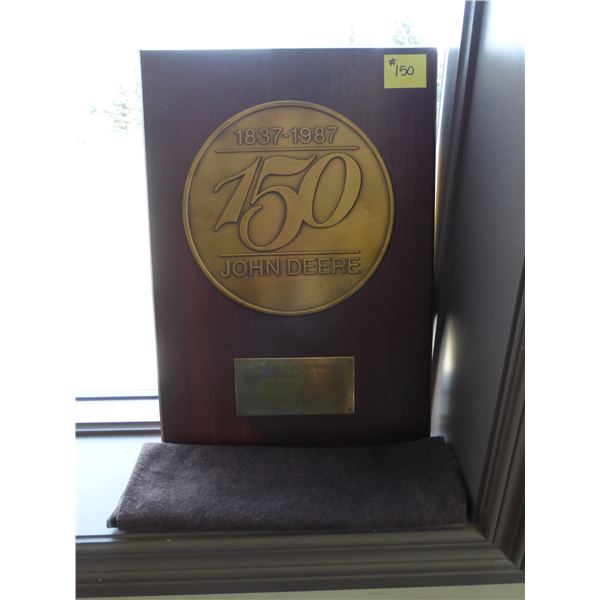 150 year anniversary John Deere plaque c/w cloth cover, 14" x 20"