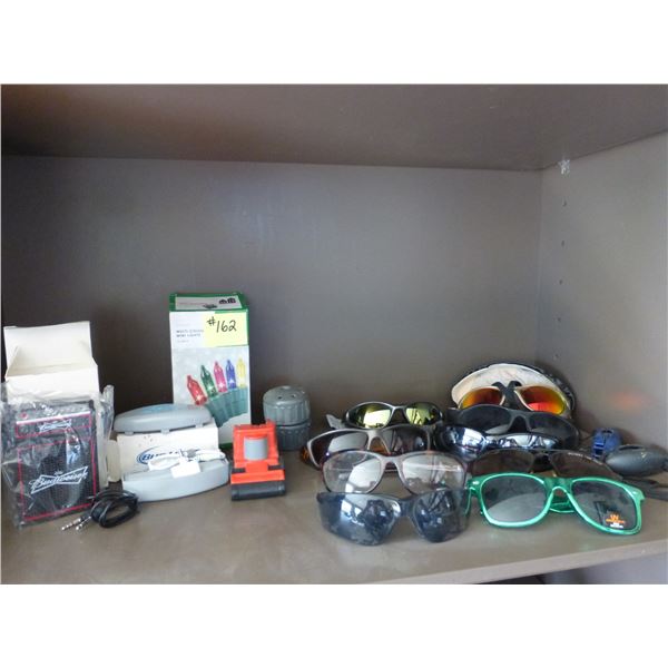 Qty of sun glasses, bluetooth speaker etc.