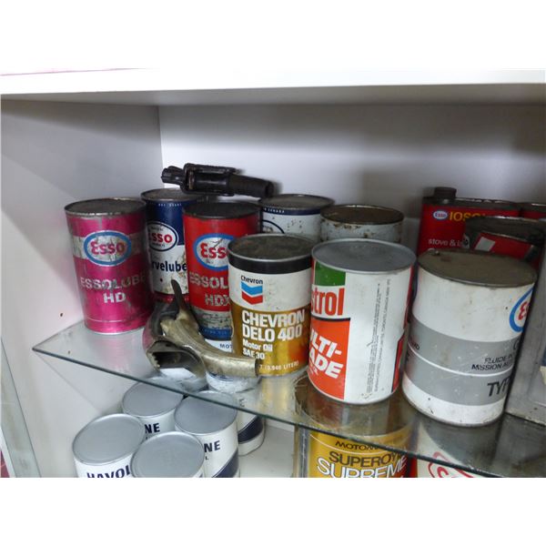 Approx. 12- oils cans (6- are full) & 2- spouts, sell together
