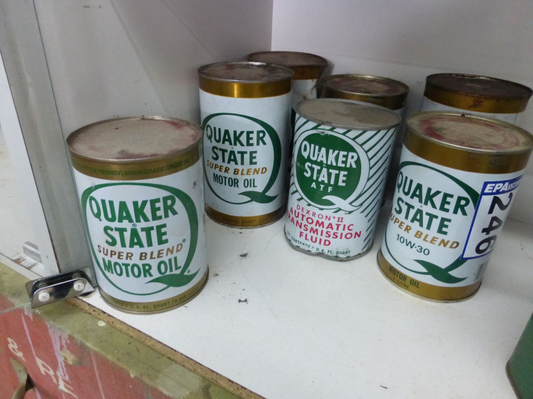 So much each x 7, 7 Quaker state oil cans, full