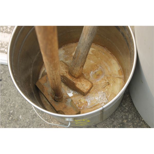 Barrel of brooms & 2- sledge hammers