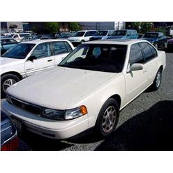 92 NISSAN MAXIMA 4DR EXMT.                                            