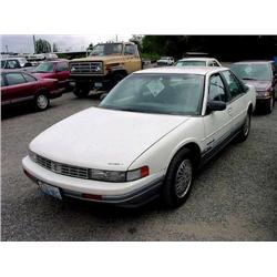 90 OLDSMOBILE CUTLASS 4DR EXMT.                                       