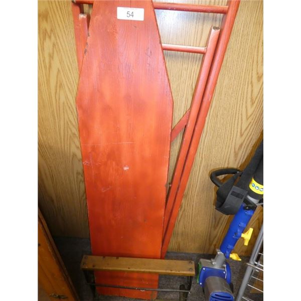 wooden ironing board and wrapping paper holder