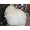 Image 3 : Norka living Azure - Halfway between a pouf and an armchair, this ultra-trendy chair in soft, white 