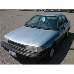89 TOYOTA COROLLA DX 4DR EXMT.                                        