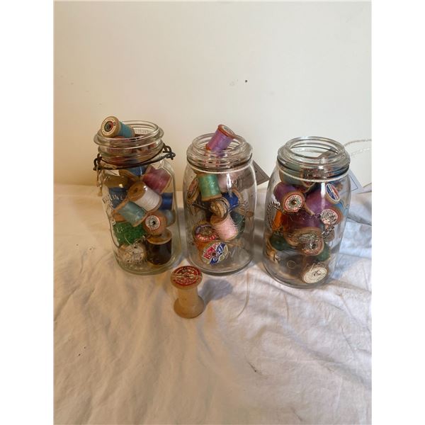 Crown and other jars and wooden  spools of threat