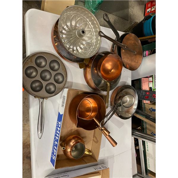 Copper pots and filled pancake pan