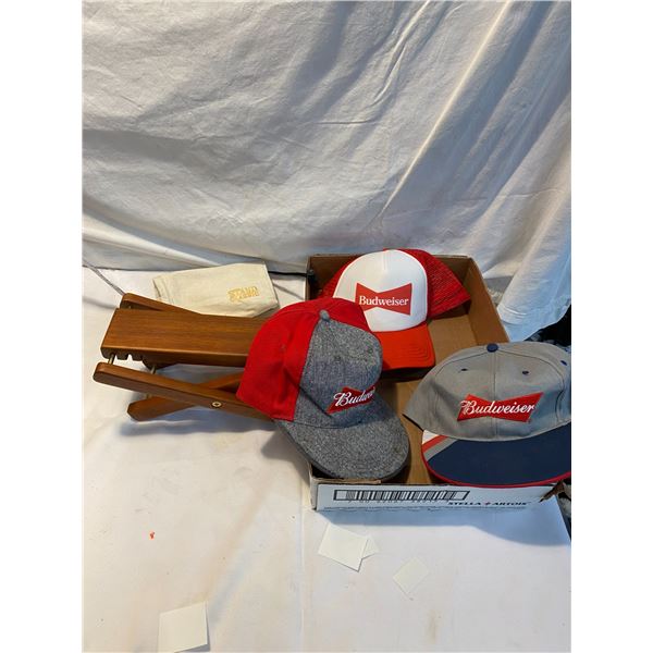 Budweiser caps and a stand