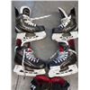 Image 3 : Two pairs of youth Bauer/CCM hockey skates and pair of gloves with 7 mini hockey stix