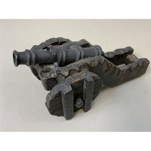 ANTIQUE MODEL OF A METAL CANNON WITH WOODEN MOUNT